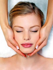Young pretty woman receiving face massage - Ziarul National