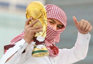 A Qatari youth holds a mock World Cup tr - Ziarul National