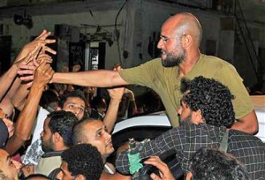 Saif Al-Islam, son of Muammar Gaddafi, greets supporters in Tripoli - Ziarul National