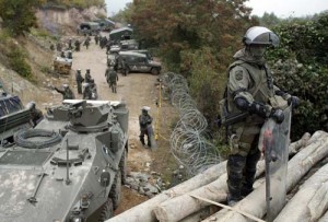 A KFOR soldier from Germany stands on a barricade in the village of Jagnjenica, near the town of Zubin Potok - Ziarul National