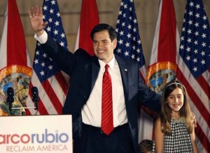 U.S. Republican Senate candidate Marco Rubio waves beside his daughter during his victory speech at a rally in Florida - Ziarul National
