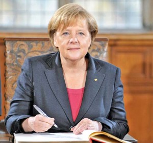 German Chancellor Angela Merkel signs th - Ziarul National