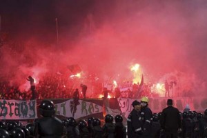 Police officers react as chaos erupts at a soccer stadium in Port Said city - Ziarul National