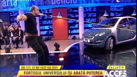 Uimitor! A tras o masina, in direct, doar cu ajutorul dintilor! (FOTO)