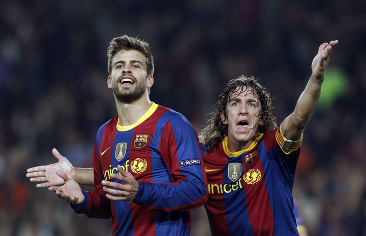 Barcelona - Ziarul National's Pique and Puyol react after the annulment of Messi's goal against FC Copenhagen during their soccer match in Barcelona
