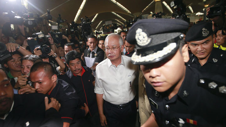Malaysia - Ziarul National's Prime Minister Najib Razak arrives at the holding area for family and friends of passengers aboard missing Malaysia Airlines flight MH370, at Kuala Lumpur International Airport
