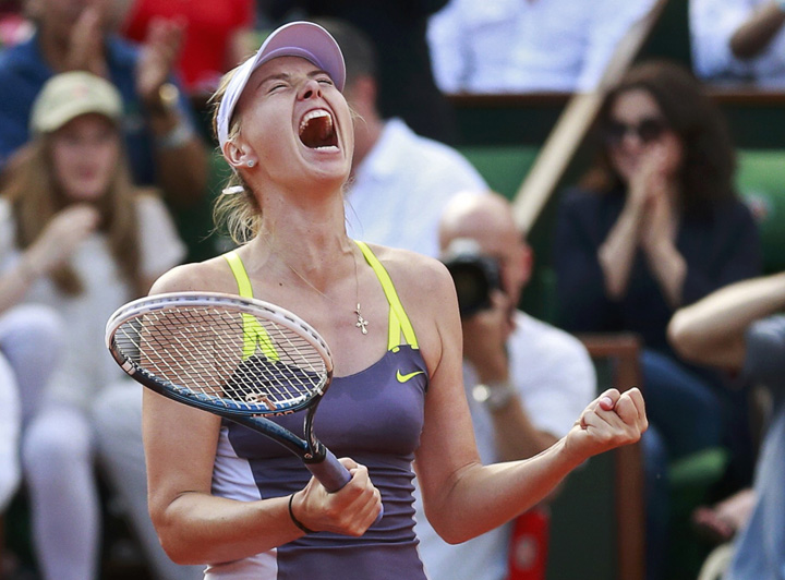 Sharapova of Russia celebrates defeating Azarenka of Belarus in their women - Ziarul National's singles semi-final match at the French Open tennis tournament in Paris