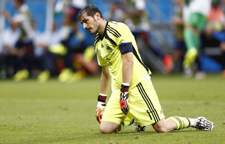 Spain - Ziarul National's goalkeeper Iker Casillas reacts after a goal by Netherlands during their 2014 World Cup Group B soccer match at the Fonte Nova arena in Salvador