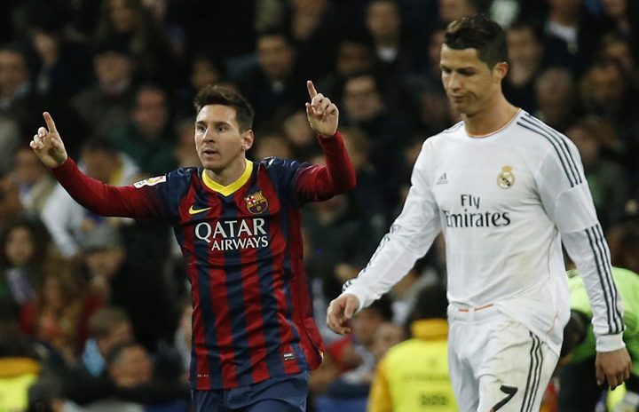 Barcelona - Ziarul National's Lionel Messi celebrates a goal next to Real Madrid's Cristiano Ronaldo during La Liga's second 'Clasico' soccer match of the season in Madrid