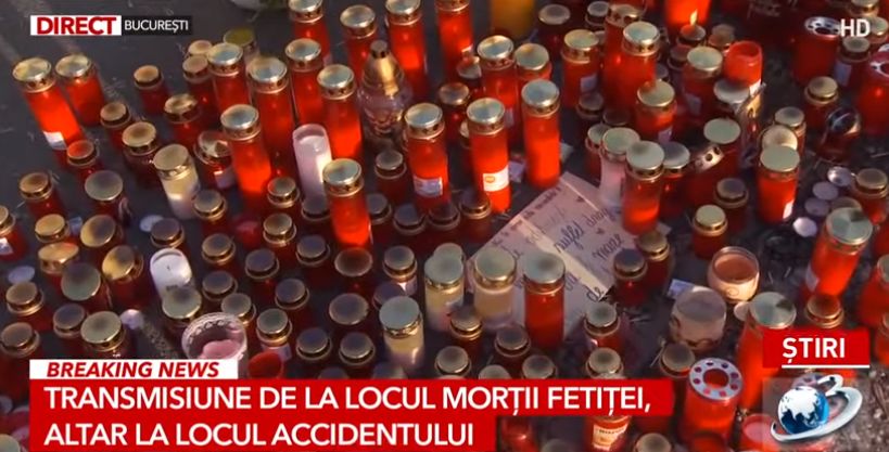 Imagini cutremurătoare. Flori și zeci de candele la locul accidentului în care a murit fetița lovită de o mașină de poliție - VIDEO