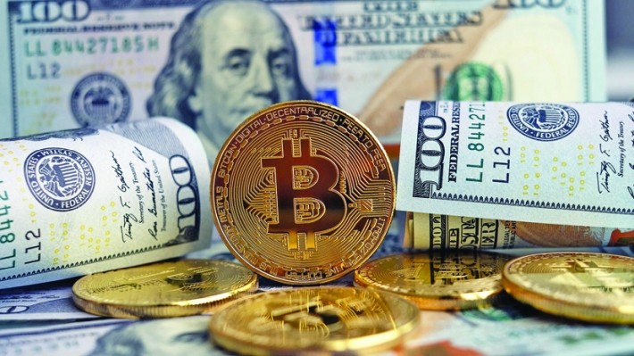 Bitcoin a spart bariera de 30.000 de dolari